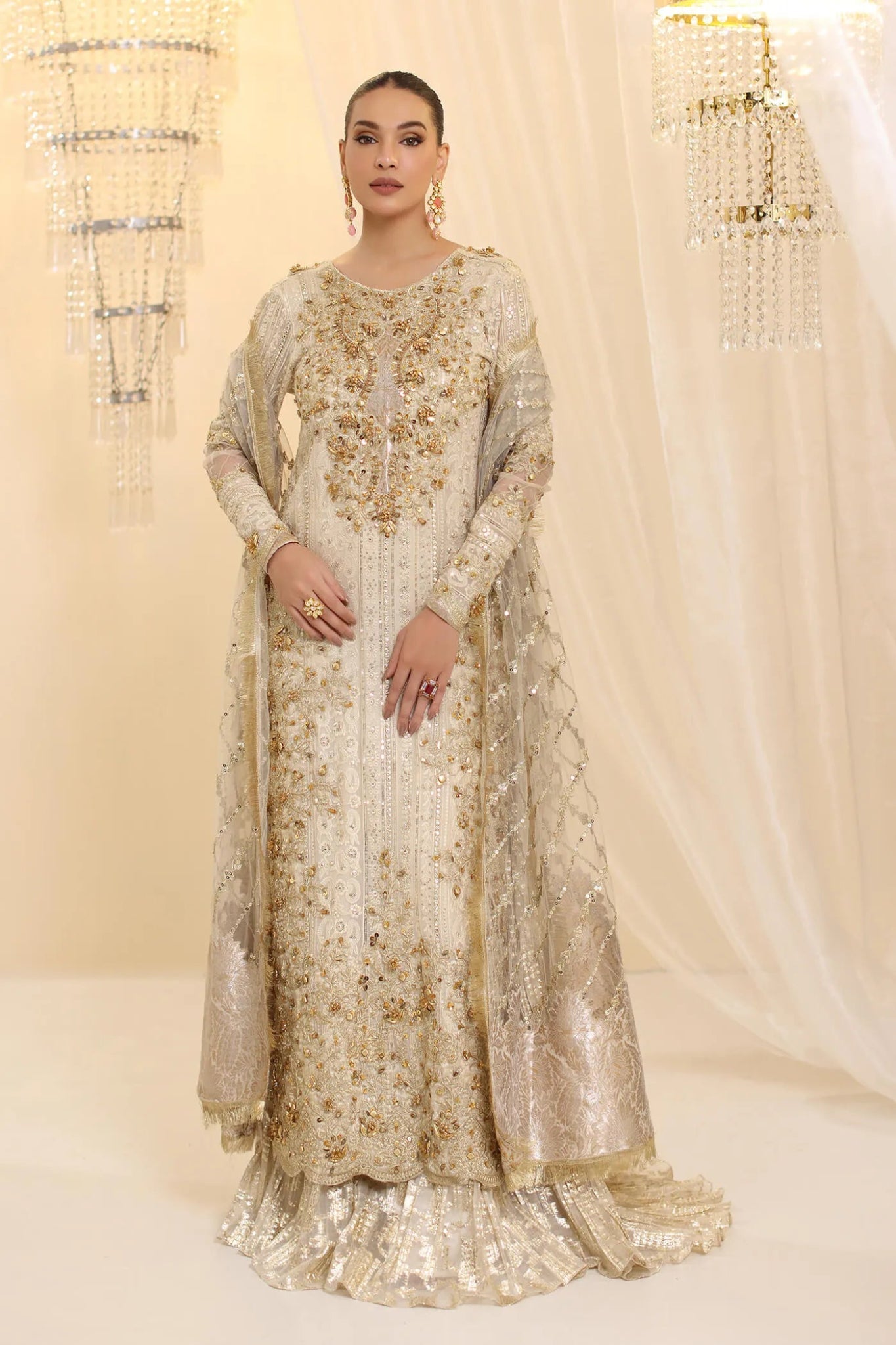 Model wearing Musferah Saad Ivory Empress dress in ivory from the Ethereal Dream Formals collection, ideal for Pakistani wedding clothes online in the UK.