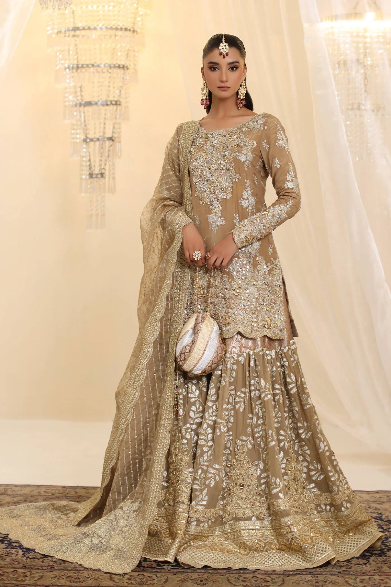 Model wearing Musferah Saad Sunlit Majesty dress in golden beige from the Ethereal Dream Formals collection, perfect for Pakistani wedding clothes online in the UK.