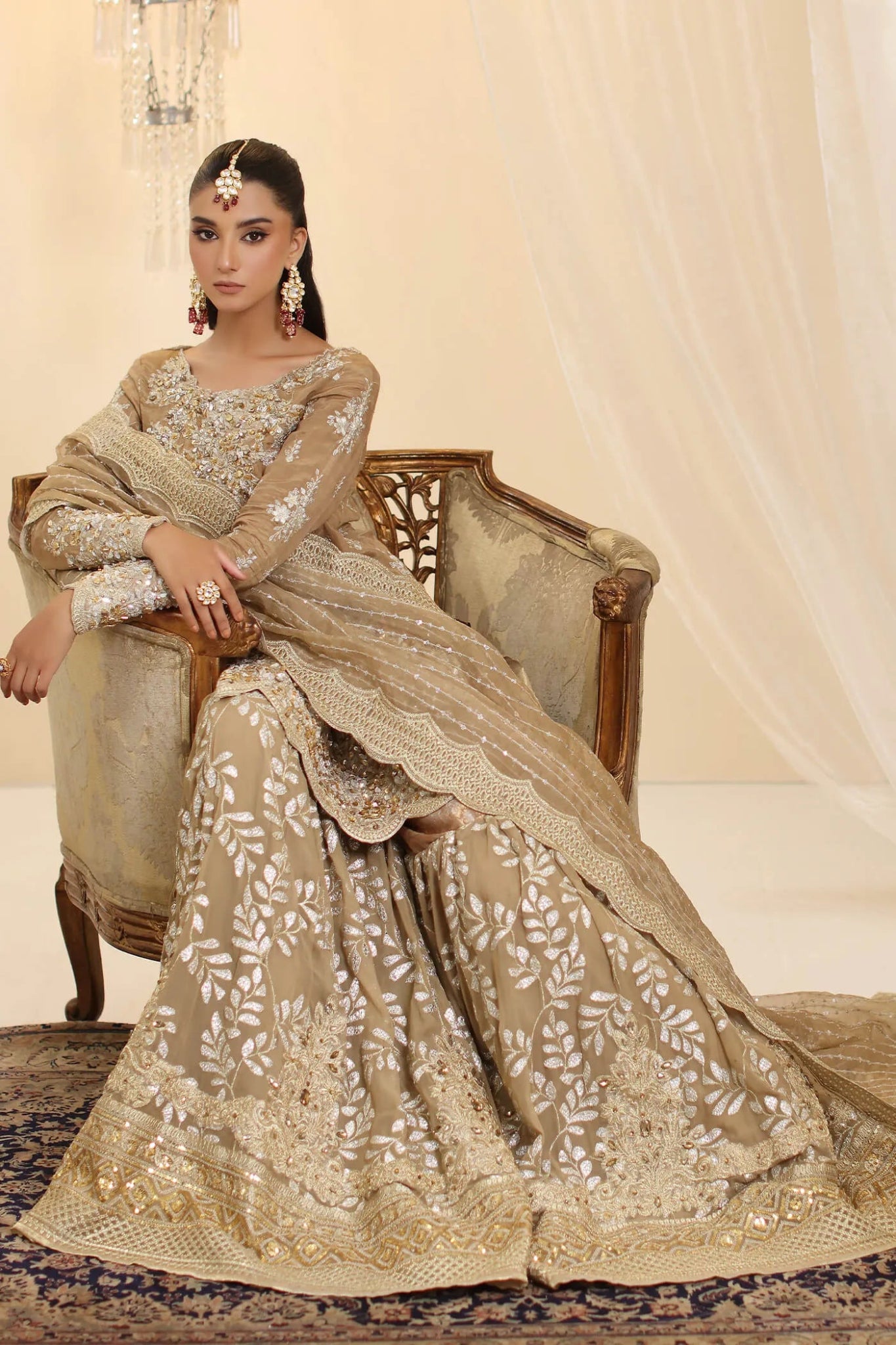 Model wearing Musferah Saad Sunlit Majesty dress in golden beige from the Ethereal Dream Formals collection, perfect for Pakistani wedding clothes online in the UK.