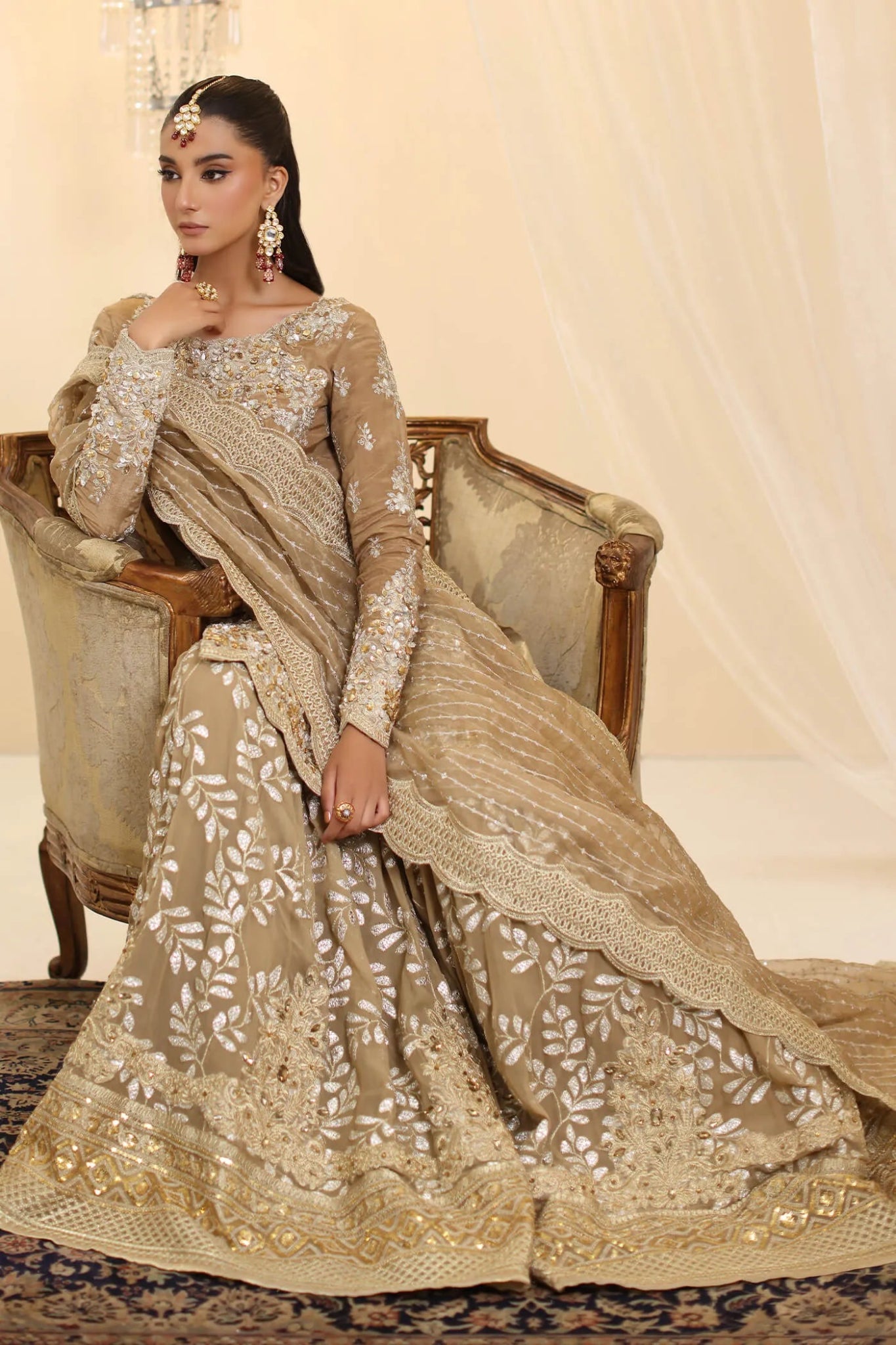 Model wearing Musferah Saad Sunlit Majesty dress in golden beige from the Ethereal Dream Formals collection, perfect for Pakistani wedding clothes online in the UK.