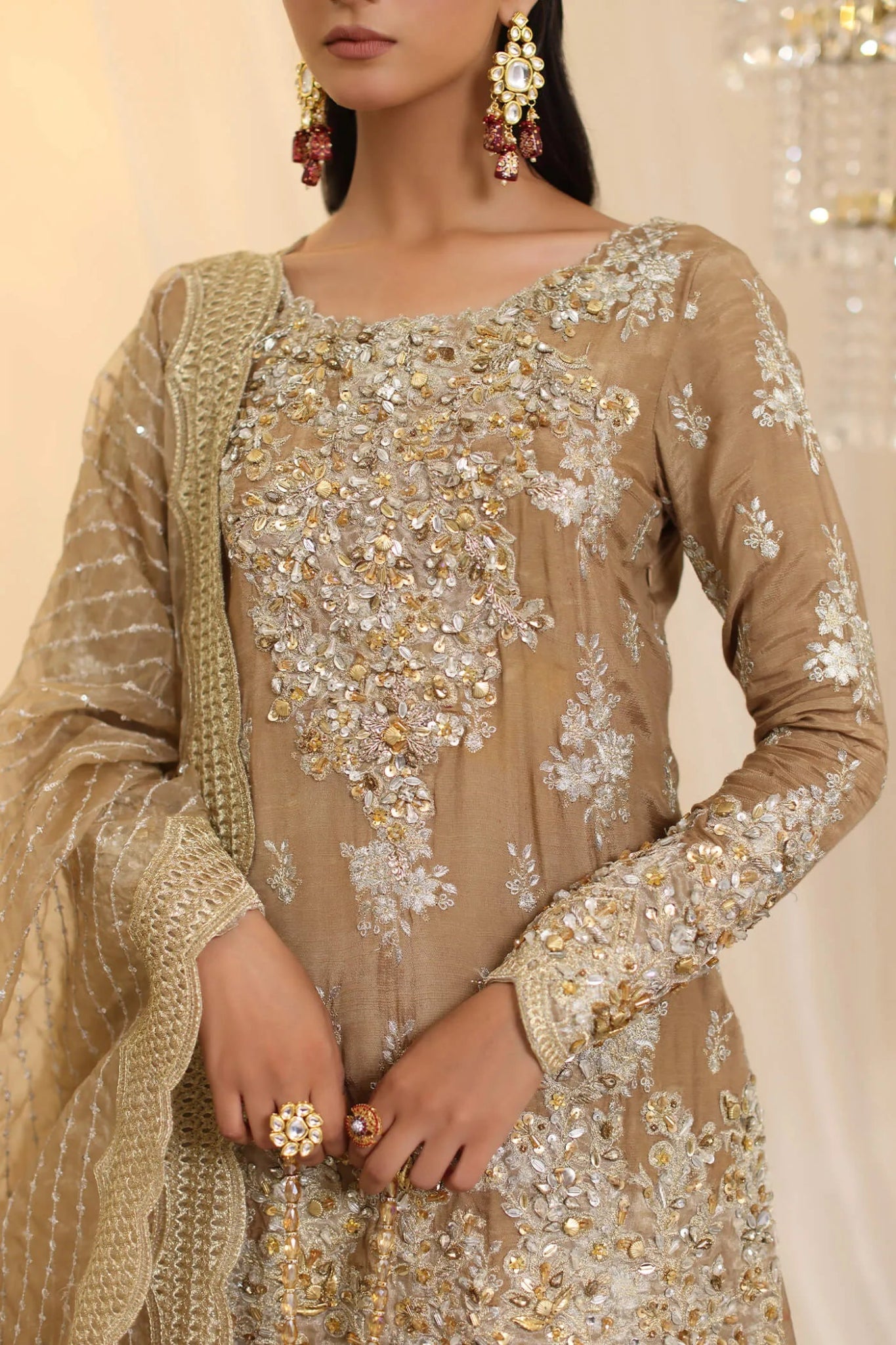 Model wearing Musferah Saad Sunlit Majesty dress in golden beige from the Ethereal Dream Formals collection, perfect for Pakistani wedding clothes online in the UK.