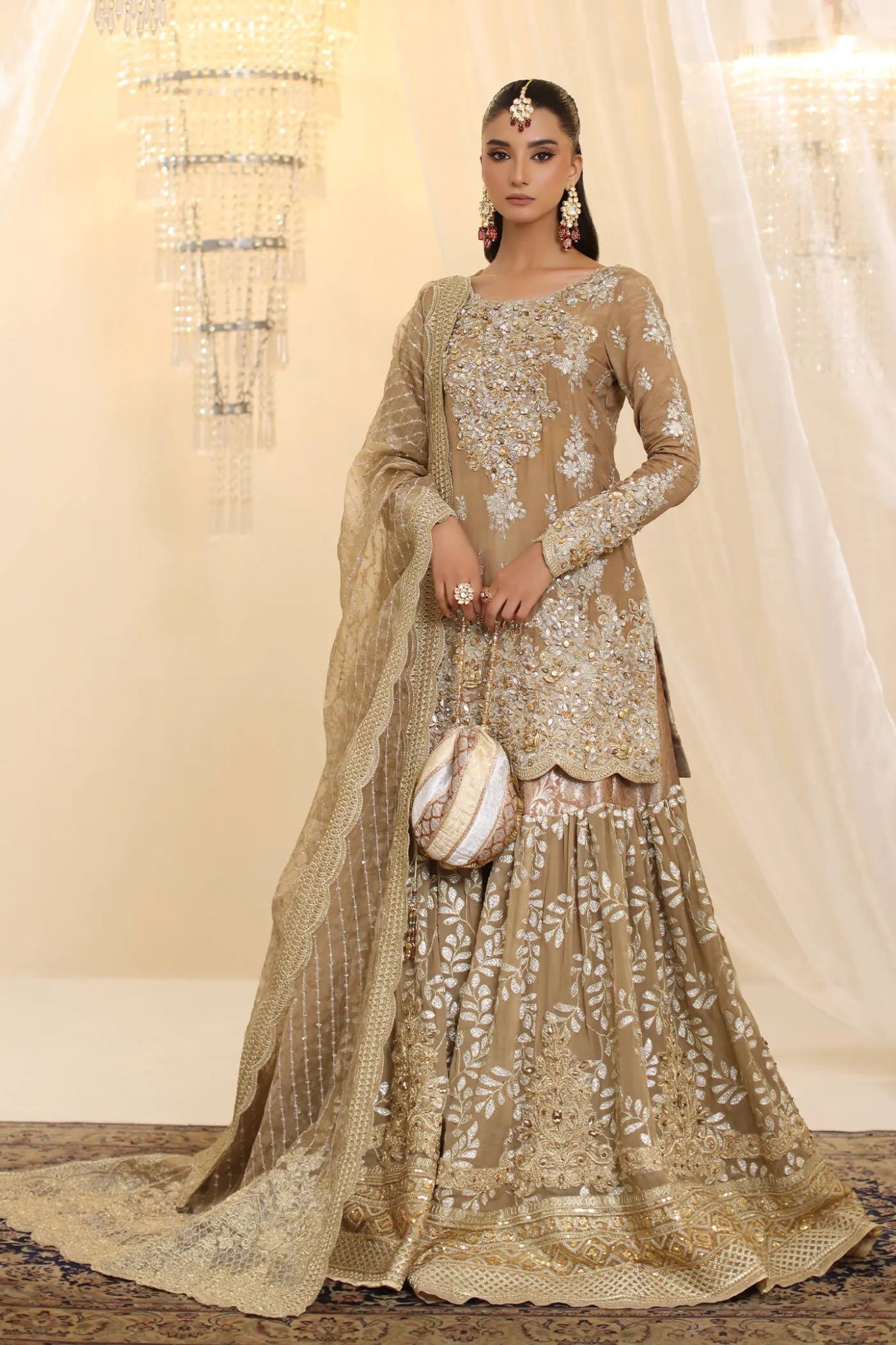 Model wearing Musferah Saad Sunlit Majesty dress in golden beige from the Ethereal Dream Formals collection, perfect for Pakistani wedding clothes online in the UK.