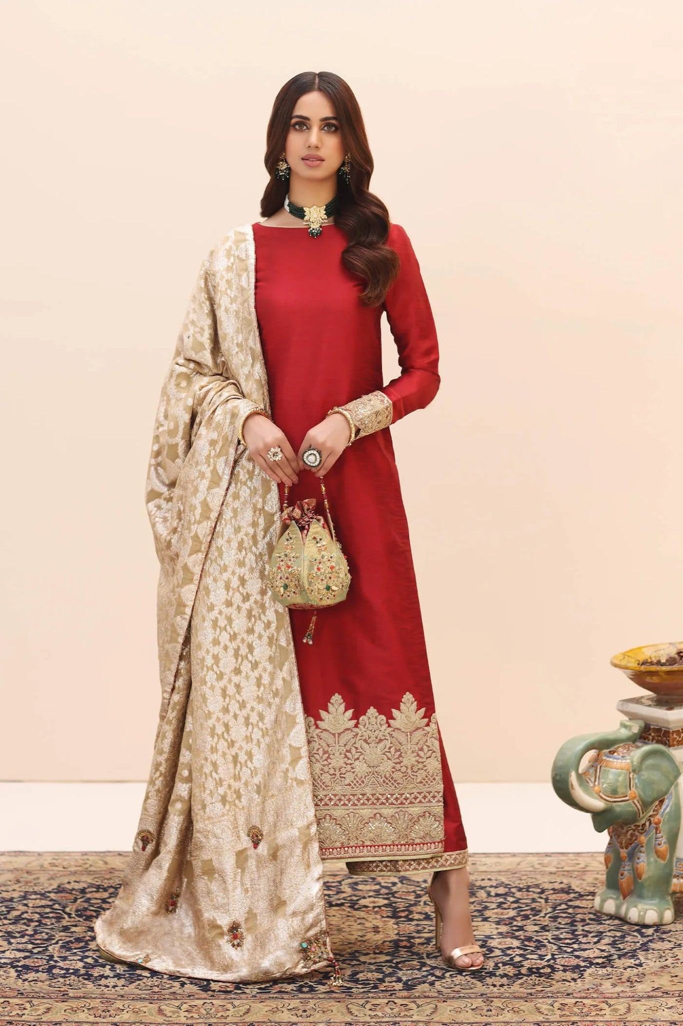 Model wearing a red ENCHANTED AURORA SHAWL dress from Musferah Saad's Ethereal Embrace Shawl Collection '23, highlighting Pakistani clothes online in the UK.