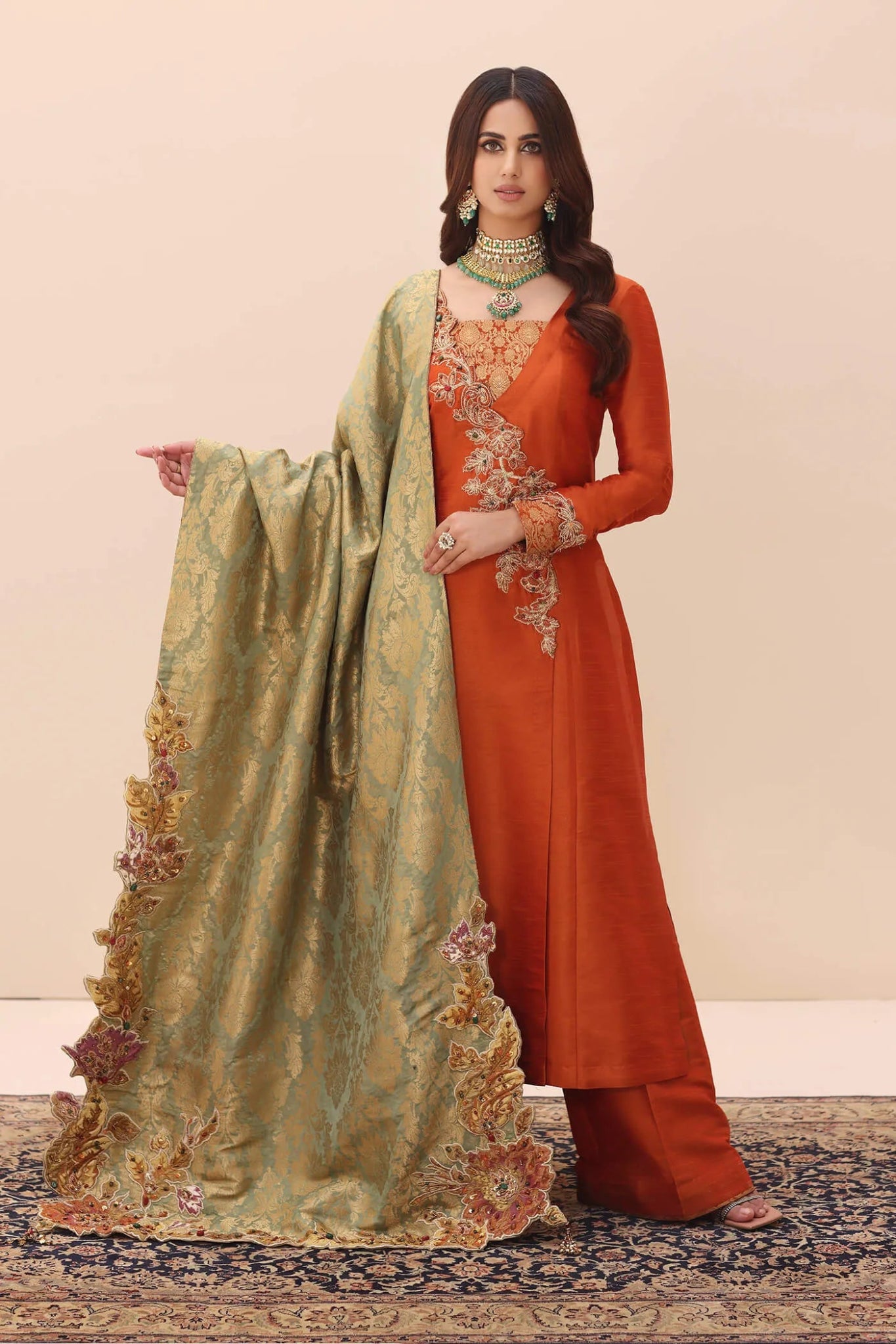 Model wearing Ethereal Embrace Shawl Collection's TANGERINE AURA SHAWLL, an equisite mold by Musferah Saad UK, Pakistani Clothes UK.