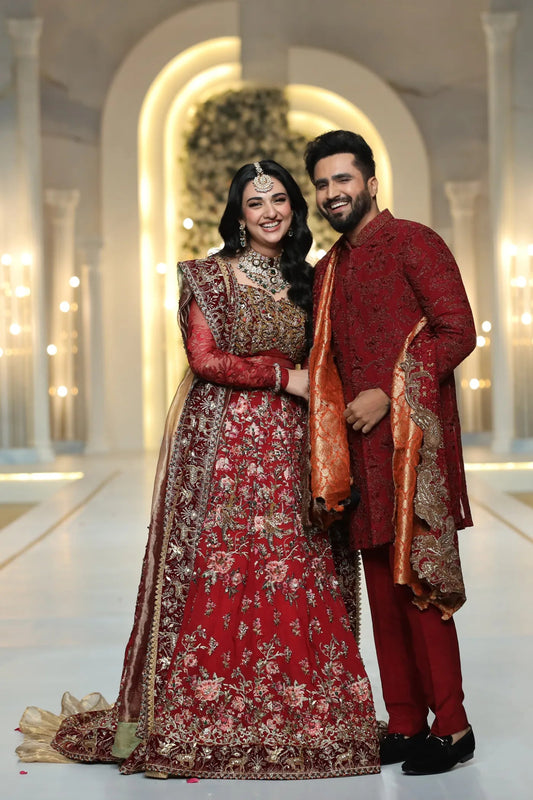 Model wearing a crimson THE SCARLET MONARCH sherwani from Musferah Saad's Luminous Love '24 collection, showcasing Pakistani clothes online in the UK.