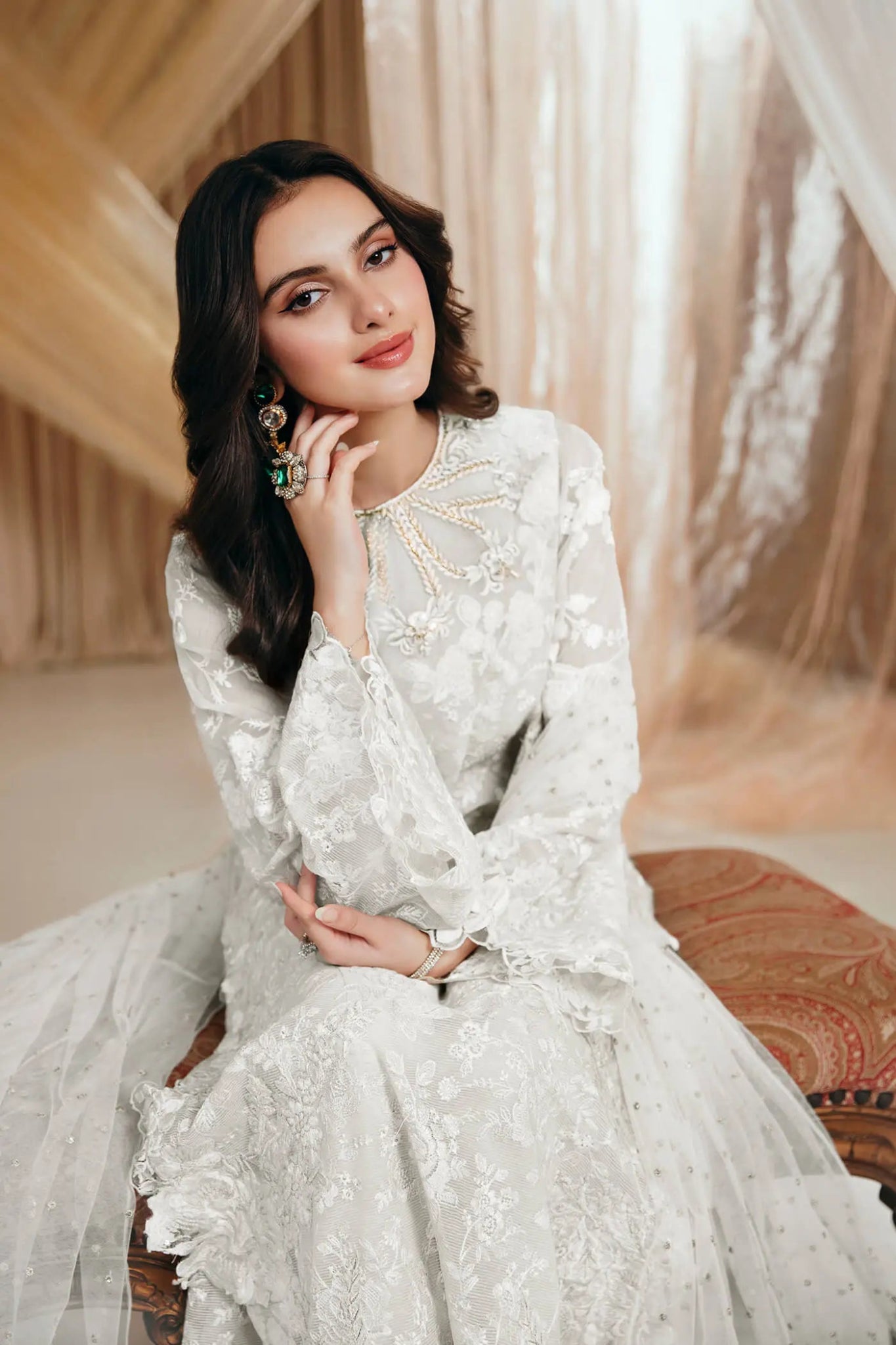 Model wearing an off - white DIVINE WHISPER dress from Musferah Saad's MYSTERE Eid collection '24, showcasing Pakistani clothes online in the UK.