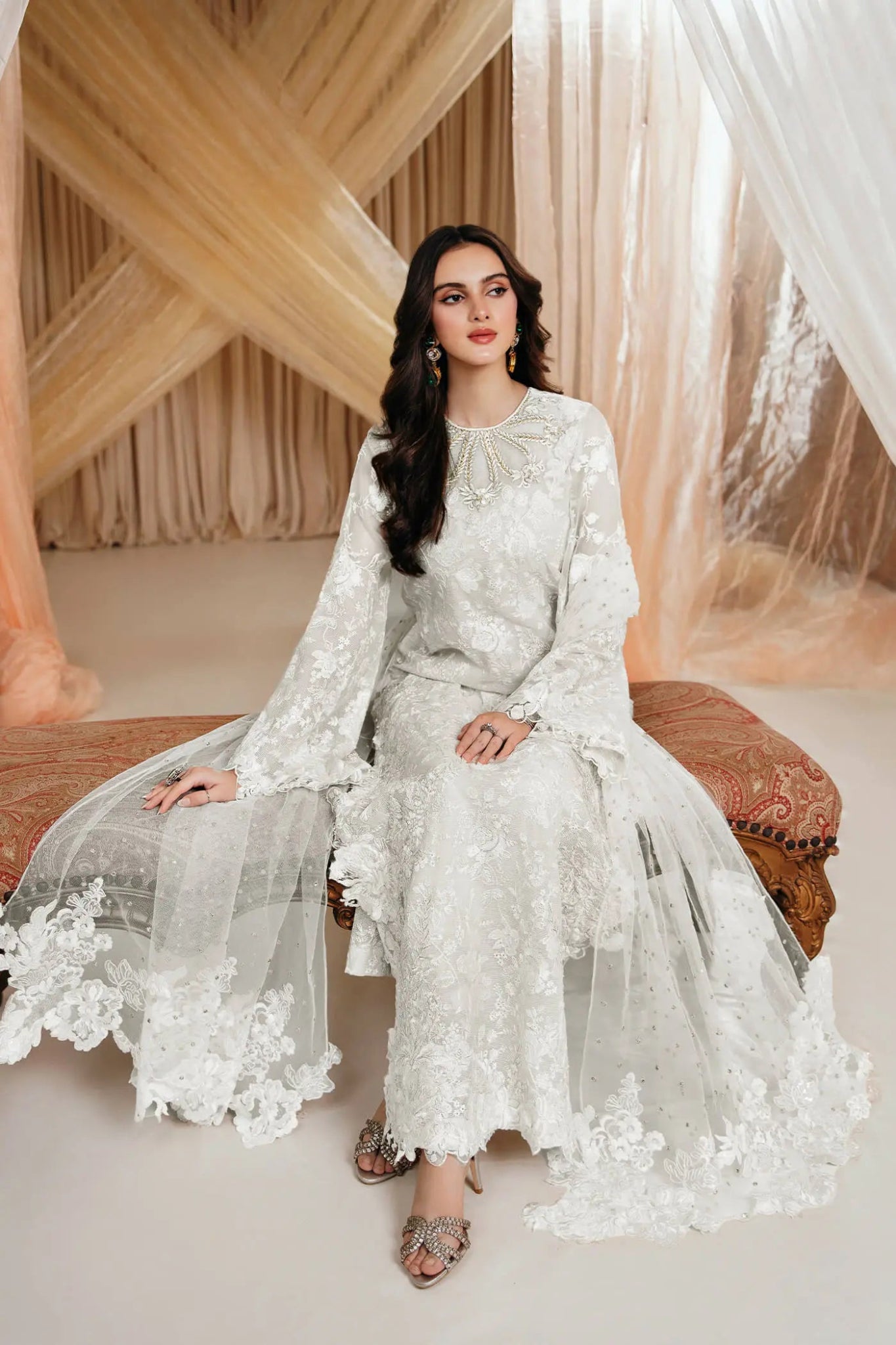 Model wearing an off - white DIVINE WHISPER dress from Musferah Saad's MYSTERE Eid collection '24, showcasing Pakistani clothes online in the UK.