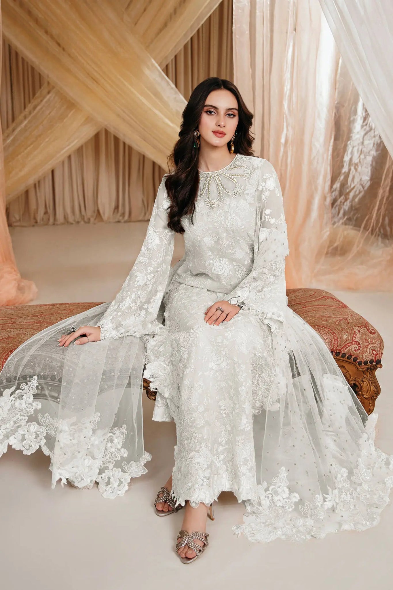 Model wearing an off - white DIVINE WHISPER dress from Musferah Saad's MYSTERE Eid collection '24, showcasing Pakistani clothes online in the UK.