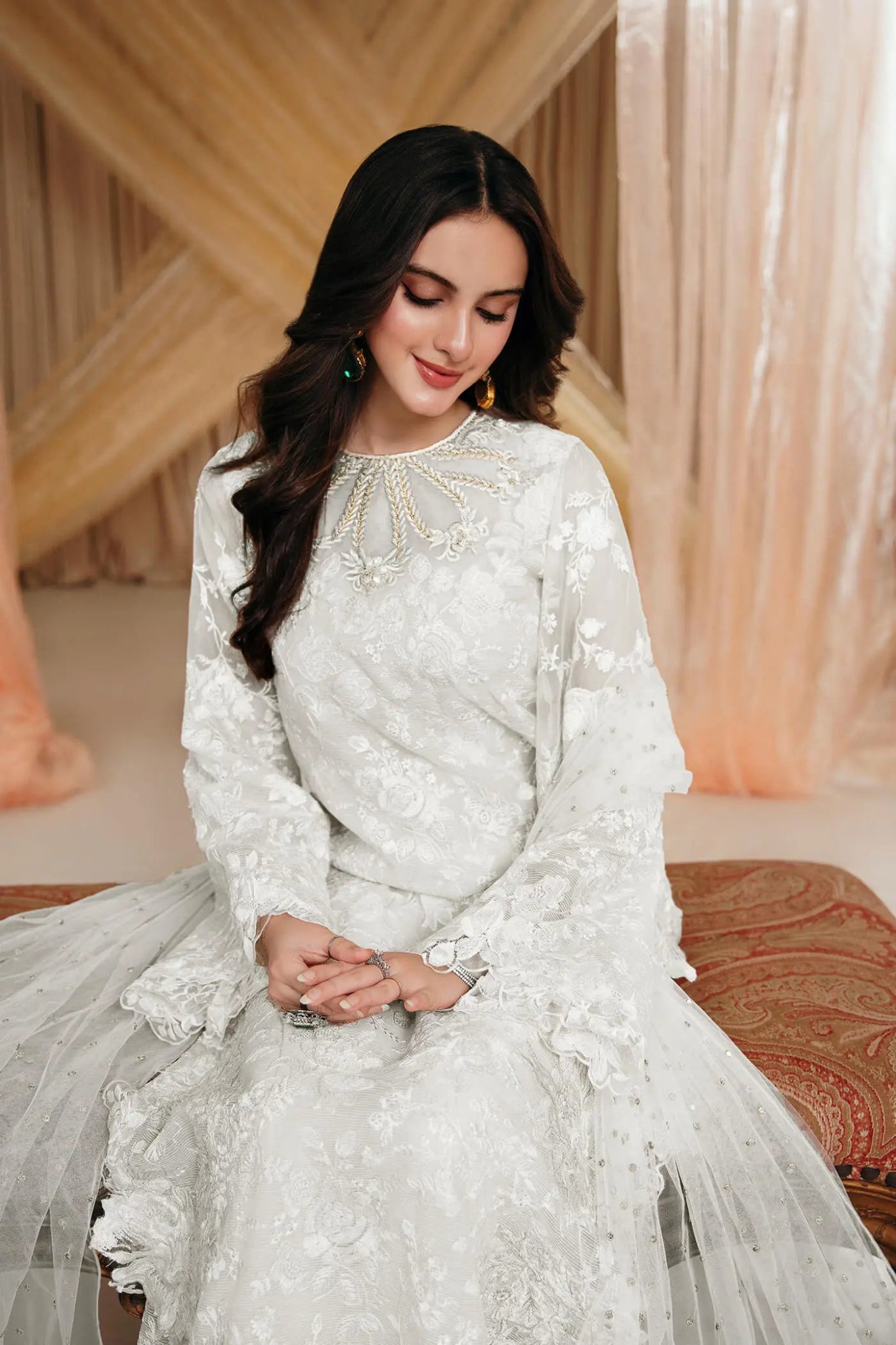 Model wearing an off - white DIVINE WHISPER dress from Musferah Saad's MYSTERE Eid collection '24, showcasing Pakistani clothes online in the UK.