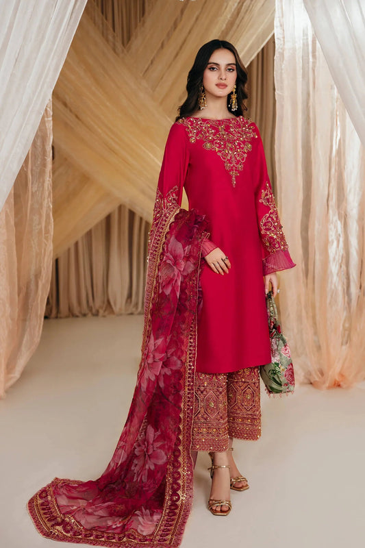 Model wearing Faiza Saqlain's Radiant Bloom dress from the Musferah Saad Mystere Eid Collection '24. A striking magenta Pakistani Eid dress with detailed gold embroidery and a floral dupatta, perfect for those seeking Pakistani designer clothes in the UK.