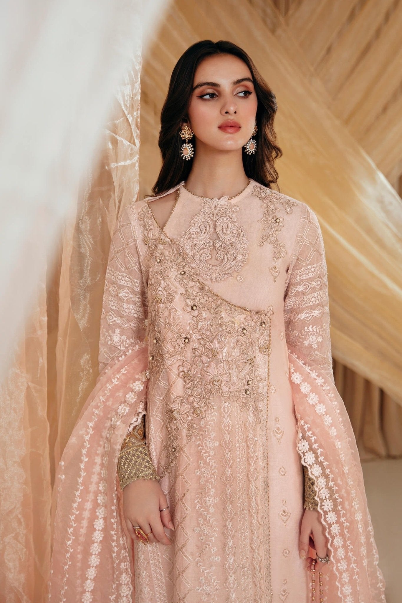 Model wearing a soft pink ROSE dress from Musferah Saad's MYSTERE Eid collection '24, showcasing Pakistani clothes online in the UK.