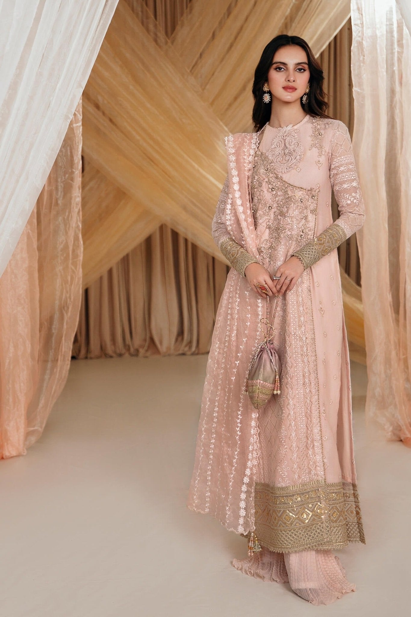 Model wearing a soft pink ROSE dress from Musferah Saad's MYSTERE Eid collection '24, showcasing Pakistani clothes online in the UK.