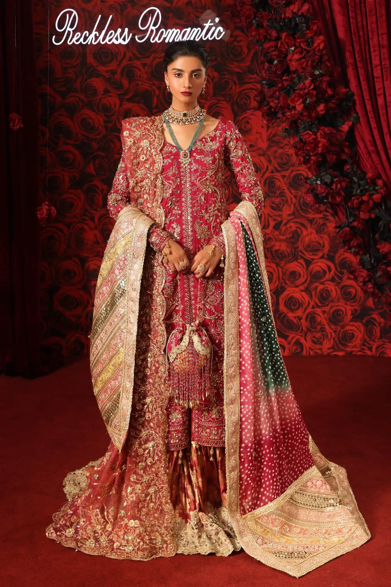 Model wearing Crimson Queen from Musferah Saad's Reckless Romantic in luxurious deep red tones. Pakistani clothes online in UK at Signature Labels