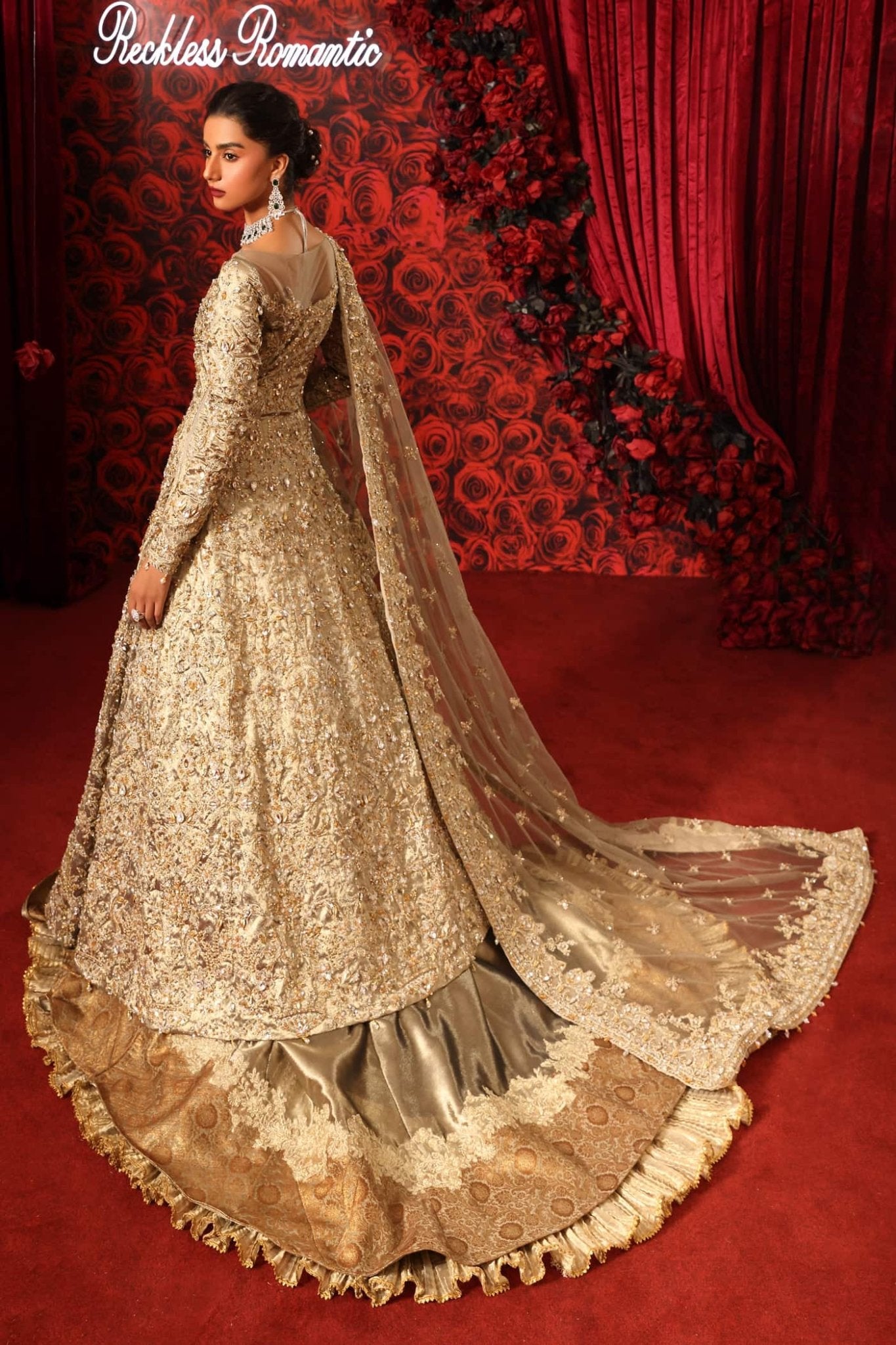 Model wearing Royal Symphony from Musferah Saad's Reckless Romantic in regal, bold colors. Pakistani clothes online in UK at Signature Labels