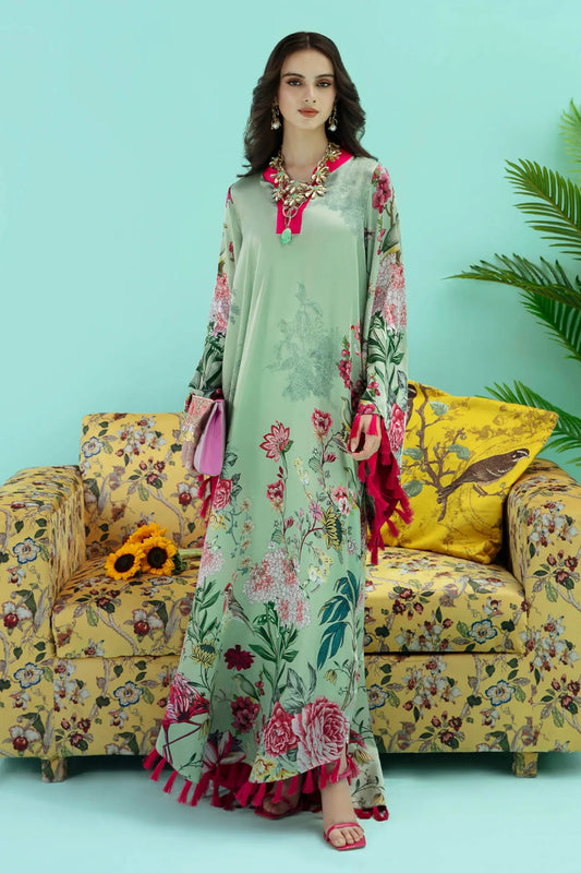 Model wearing a colorful fusion of mint FLAMINGO BLUSH dress from Musferah Saad's Resort collection '24, showcasing Pakistani clothes online in the UK.