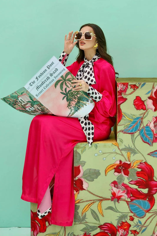 Model wearing fuchsia PIZZAZZ dress from Musferah Saad's Resort collection '24, showcasing Pakistani clothes online in the UK.