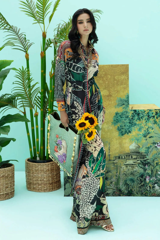 Model wearing a colorful fusion of black, rust, and green SAFARI SWAY dress from Musferah Saad's Resort collection '24, showcasing Pakistani clothes online in the UK.