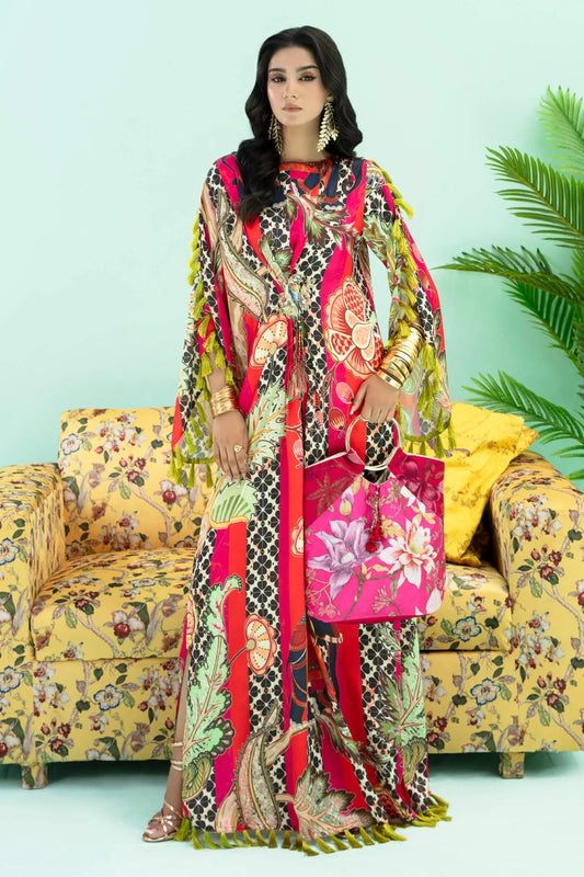 Model wearing a colorful fusion of pink, red, and sage TROPICANO dress from Musferah Saad's Resort collection '24, showcasing Pakistani clothes online in the UK.