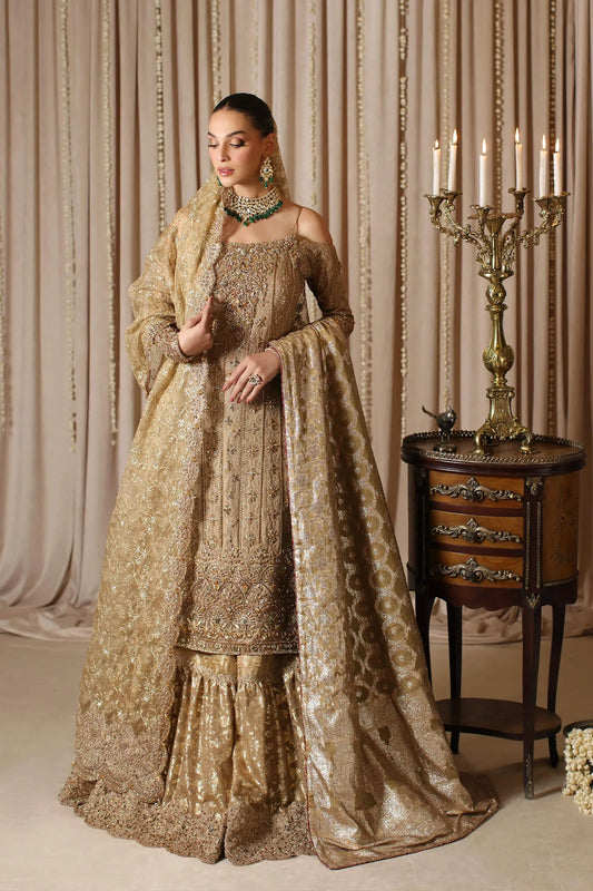 Model wearing a gold CELESTIAL CROWN dress from Musferah Saad's The Modern Maharani '23 collection, showcasing Pakistani clothes online in the UK.