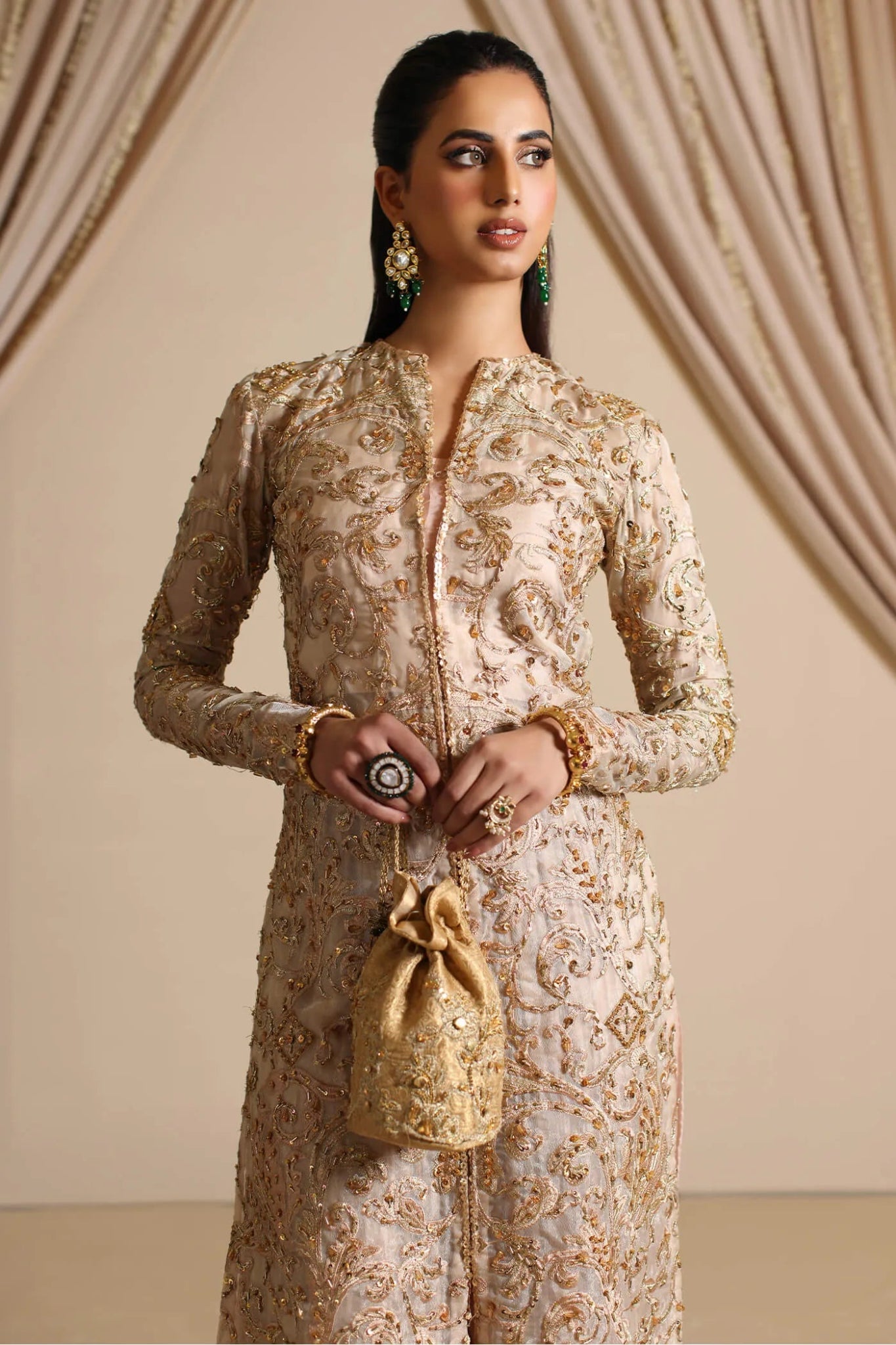 Model wearing a golden GOLDEN MIRAGE dress from Musferah Saad's The Modern Maharani '23 collection, showcasing Pakistani clothes online in the UK.