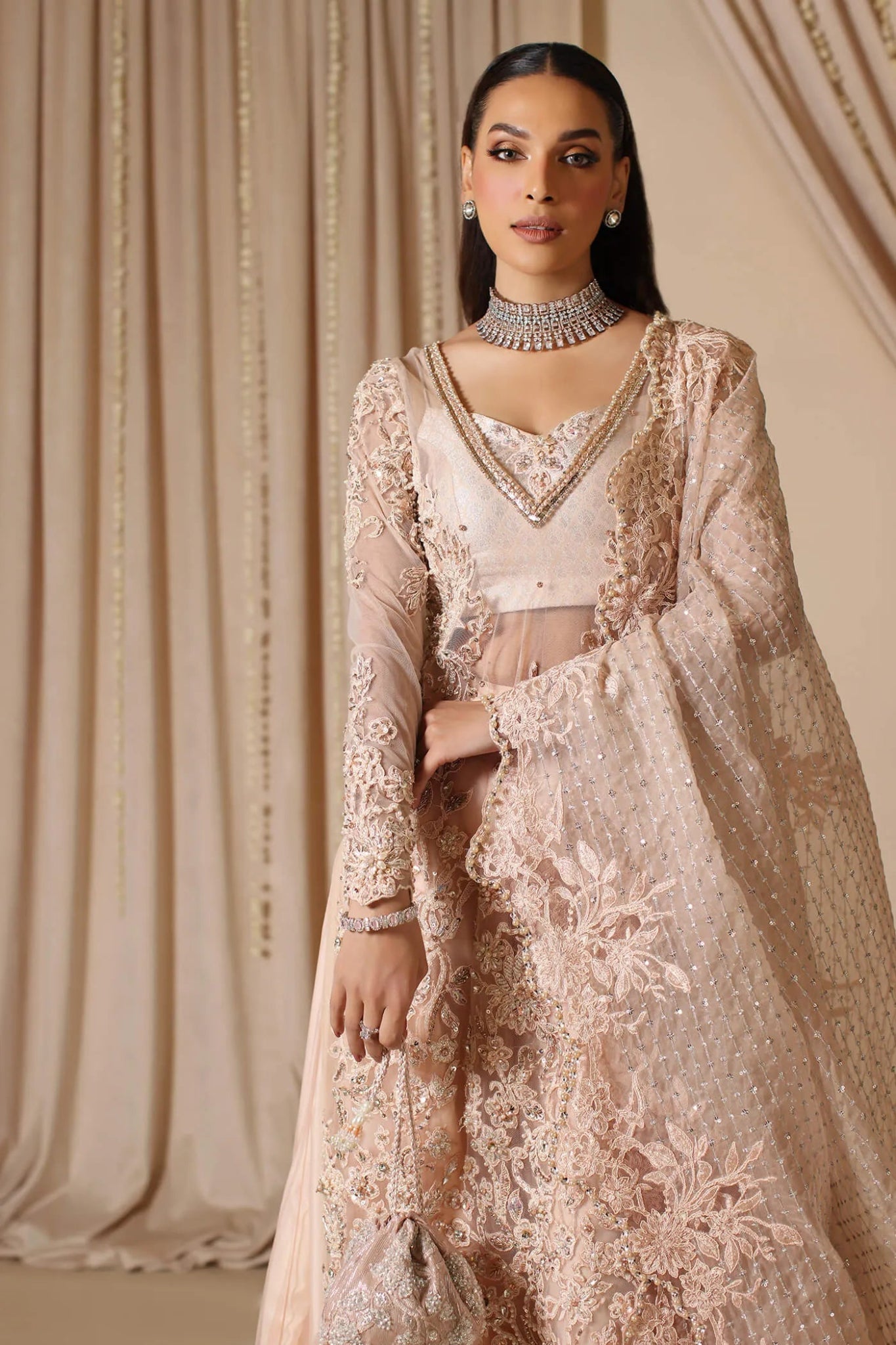 Model wearing a blush pink MAJESTIC FANTASY dress from Musferah Saad's The Modern Maharani '23 collection, showcasing Pakistani clothes online in the UK.