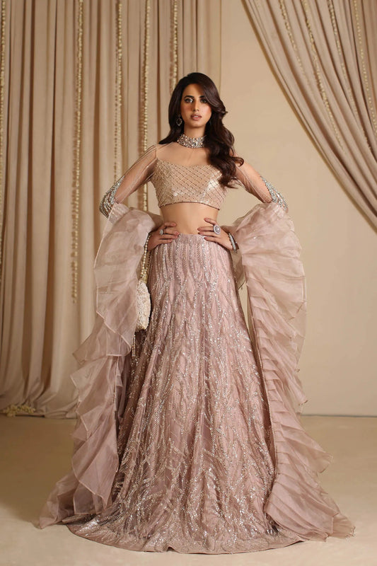 Model wearing a blush pink PRINCESS ROSETTE dress from Musferah Saad's The Modern Maharani '23 collection, showcasing Pakistani clothes online in the UK.