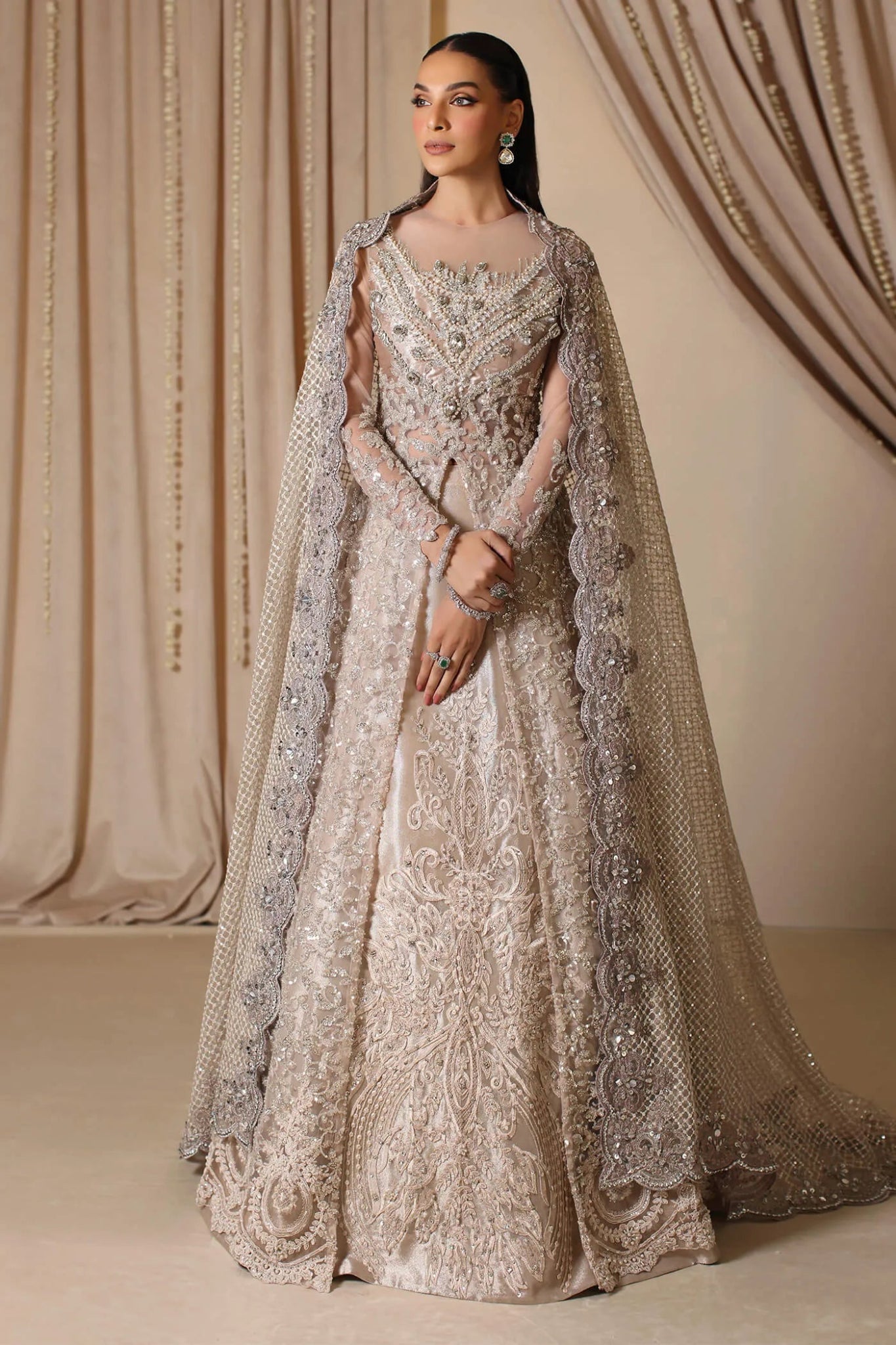 Model wearing a rose gold ROYAL ROSE dress from Musferah Saad's The Modern Maharani '23 collection, highlighting Pakistani clothes online in the UK.