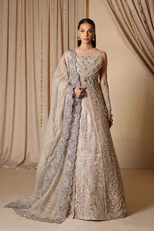 Model wearing a rose gold ROYAL ROSE dress from Musferah Saad's The Modern Maharani '23 collection, highlighting Pakistani clothes online in the UK.