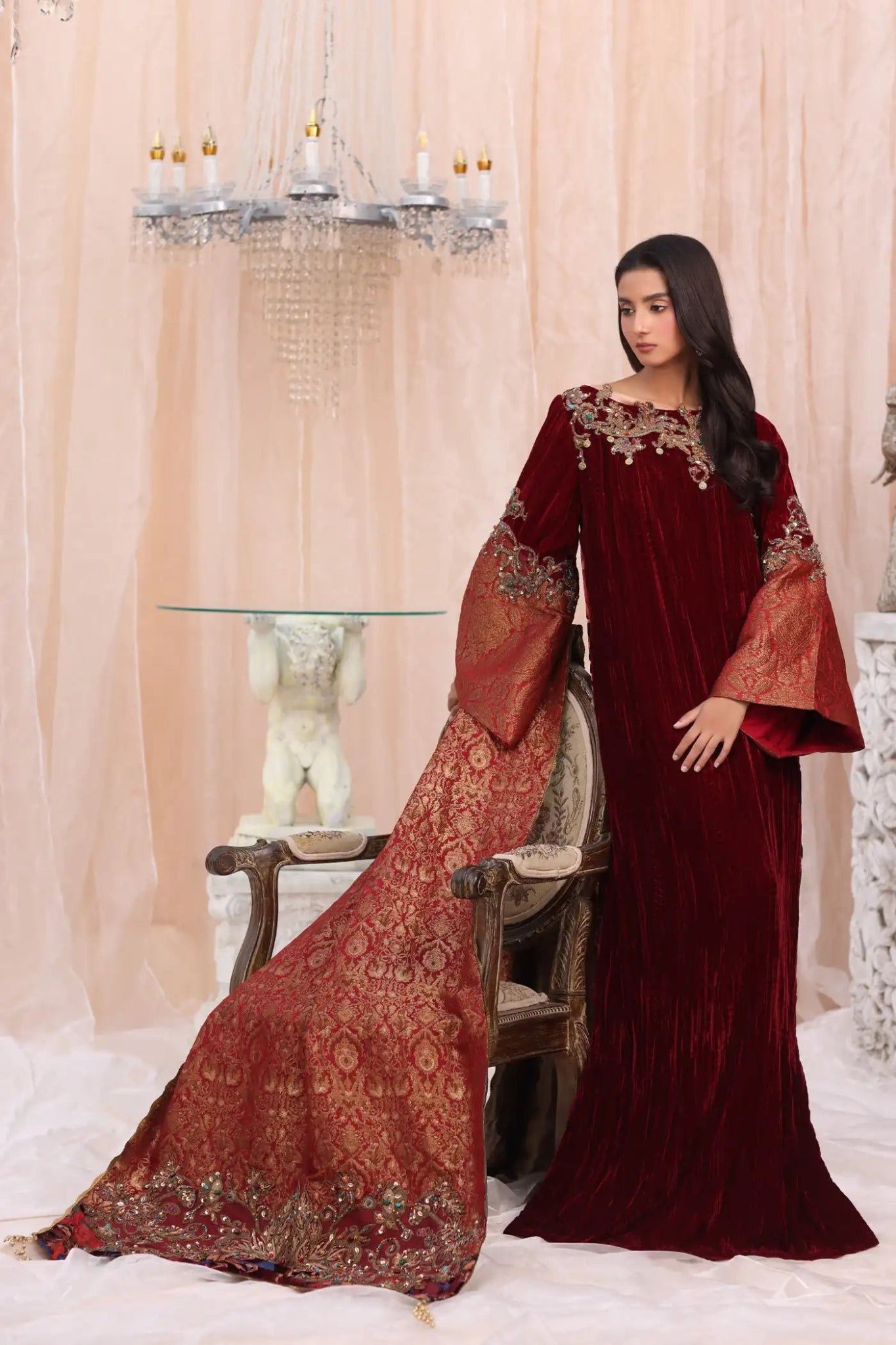 Model wearing Crimson Flame from Musferah Saad's The Serenade collection in deep red, ideal for weddings. Pakistani clothes online in UK at Signature Labels.