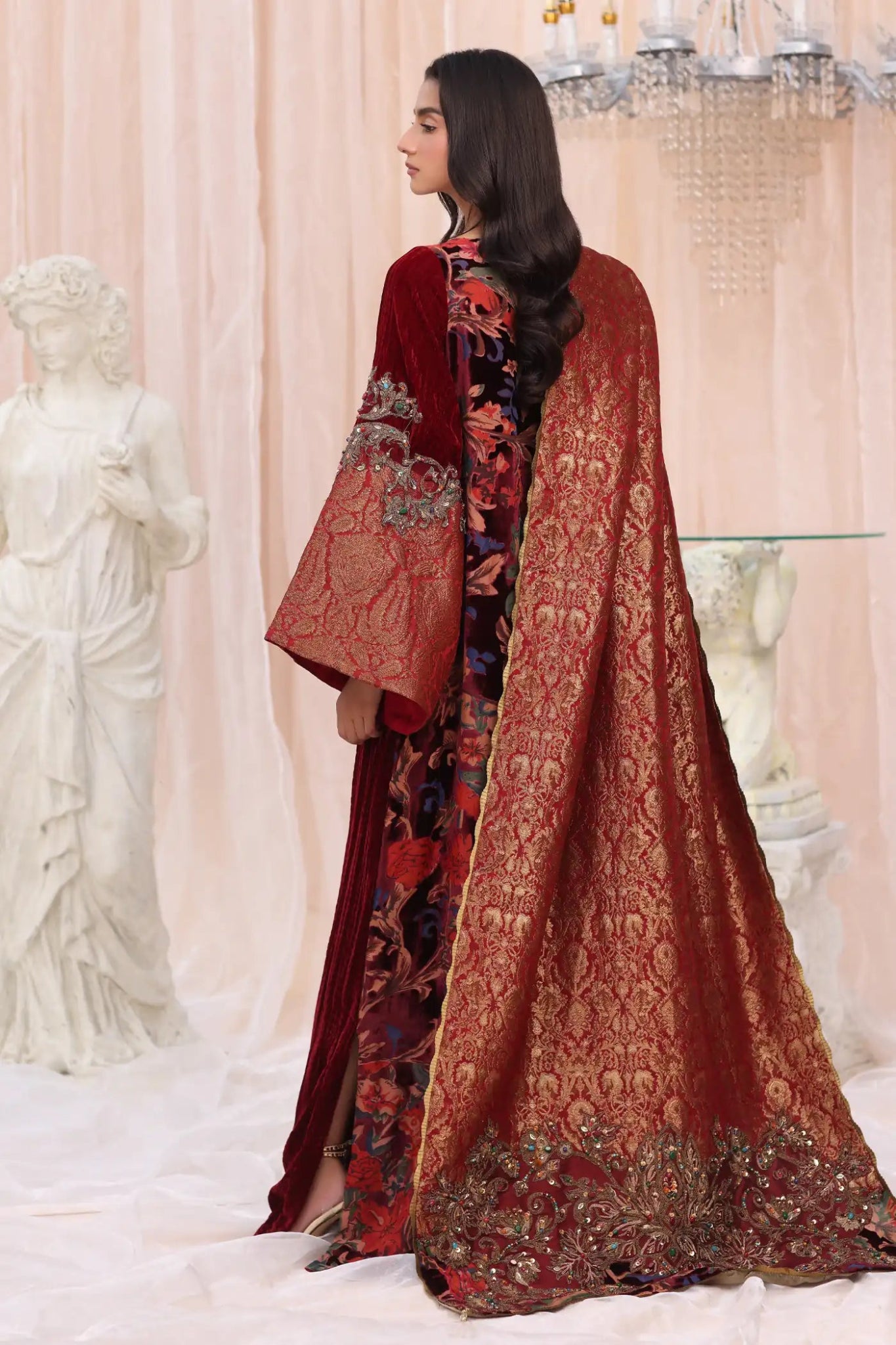 Model wearing Crimson Flame from Musferah Saad's The Serenade collection in deep red, ideal for weddings. Pakistani clothes online in UK at Signature Labels.