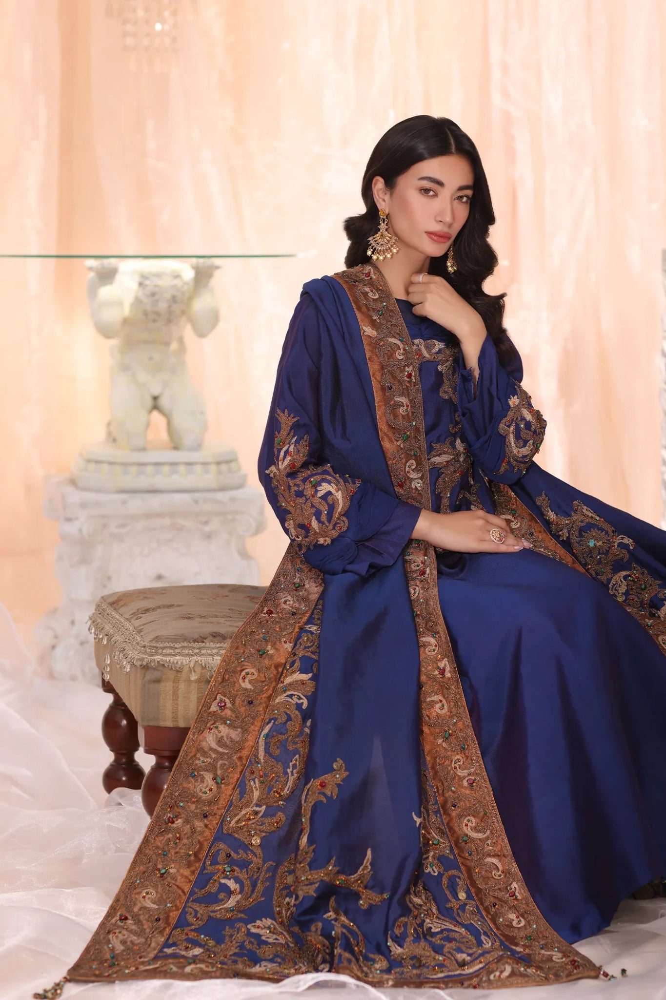 Model wearing Sapphire Empress from Musferah Saad's The Serenade collection, featuring elegant blue hues. Pakistani clothes online in UK at Signature Labels.