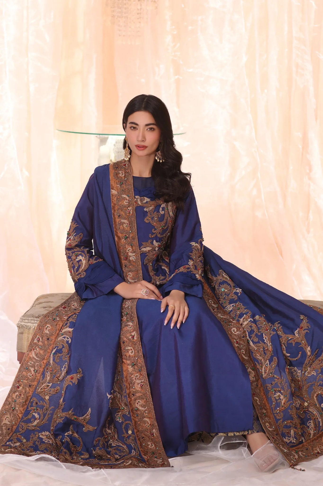 Model wearing Sapphire Empress from Musferah Saad's The Serenade collection, featuring elegant blue hues. Pakistani clothes online in UK at Signature Labels.