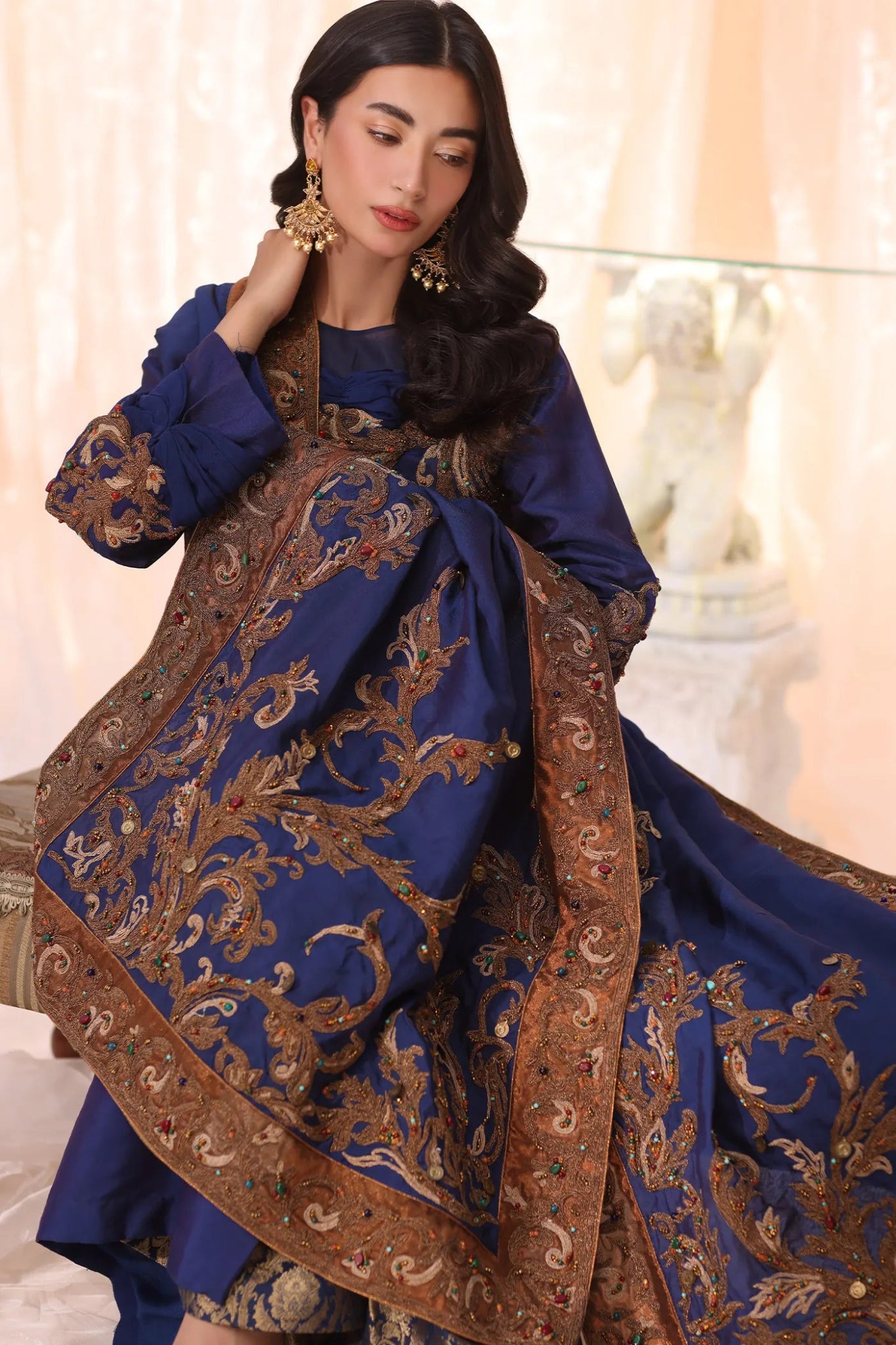 Model wearing Sapphire Empress from Musferah Saad's The Serenade collection, featuring elegant blue hues. Pakistani clothes online in UK at Signature Labels.