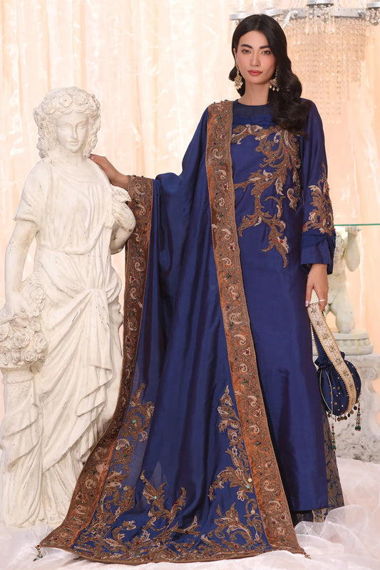 Model wearing Sapphire Empress from Musferah Saad's The Serenade collection, featuring elegant blue hues. Pakistani clothes online in UK at Signature Labels.