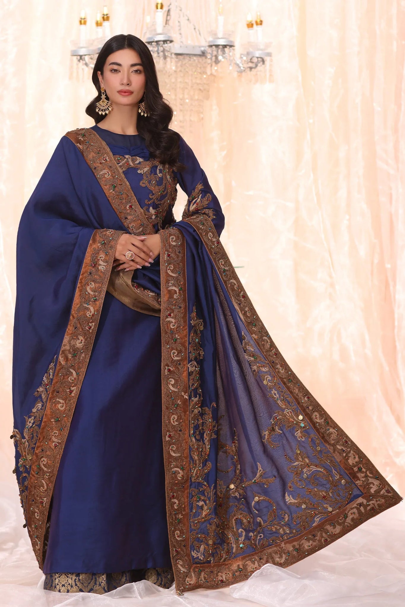 Model wearing Sapphire Empress from Musferah Saad's The Serenade collection, featuring elegant blue hues. Pakistani clothes online in UK at Signature Labels.