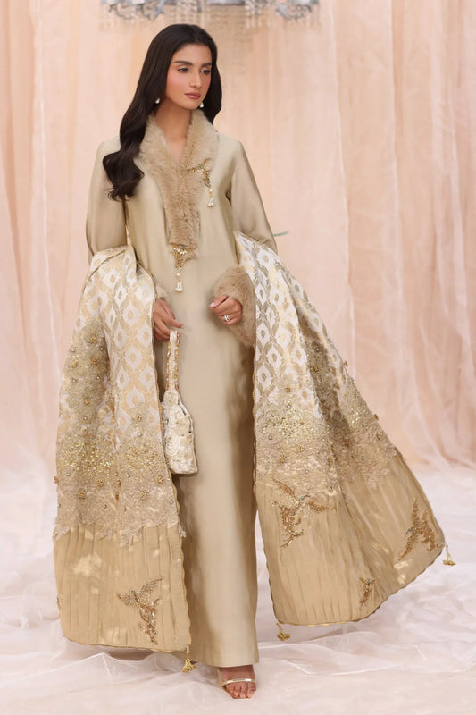 Model wearing The Duchess from Musferah Saad's The Serenade collection in elegant cream, perfect for weddings. Pakistani clothes online in UK at Signature Labels.