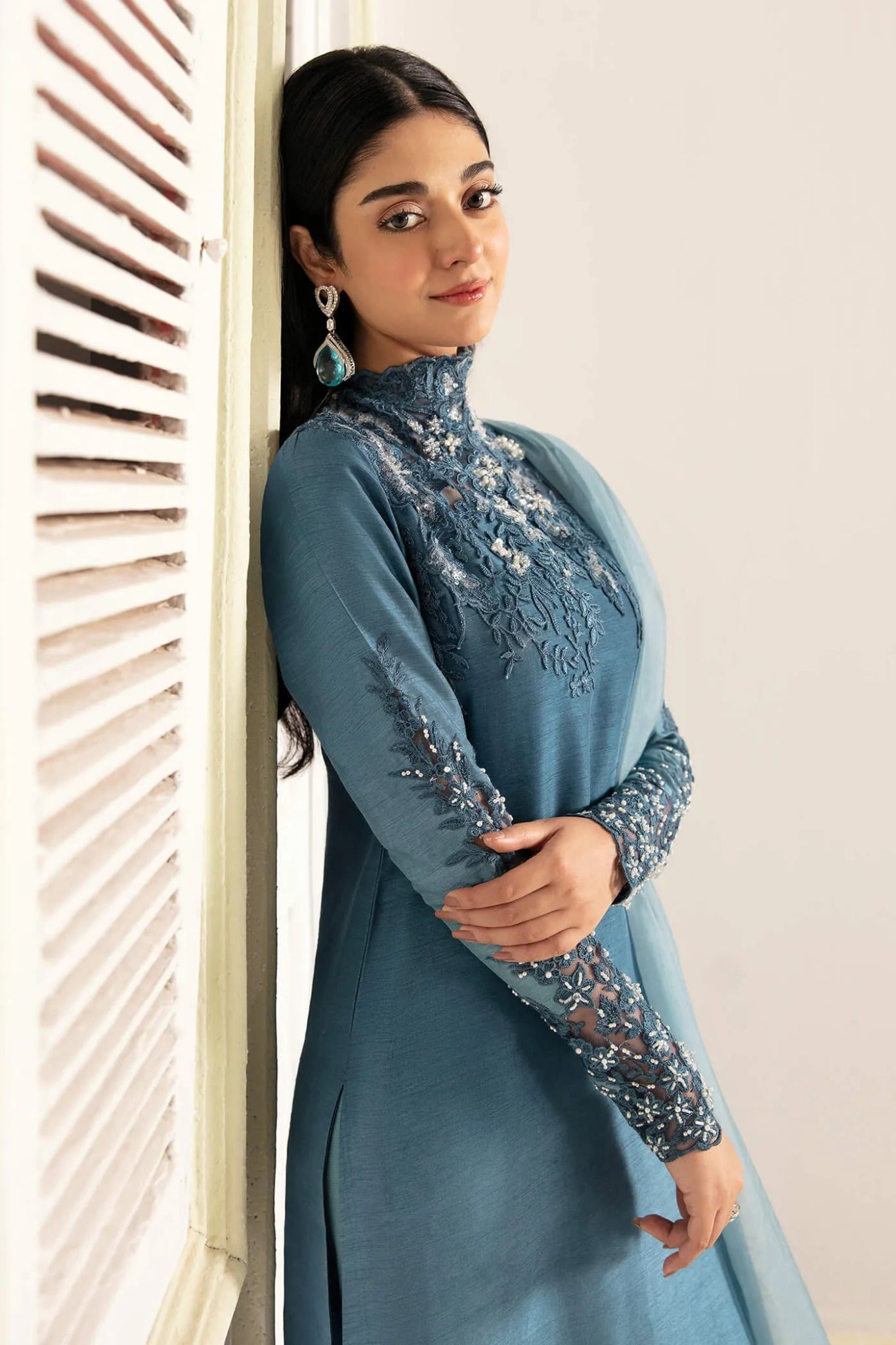 Model wearing a blue AQUA ROMANCE dress from Musferah Saad's VIVA LA VIDA collection, showcasing Pakistani clothes online in the UK.