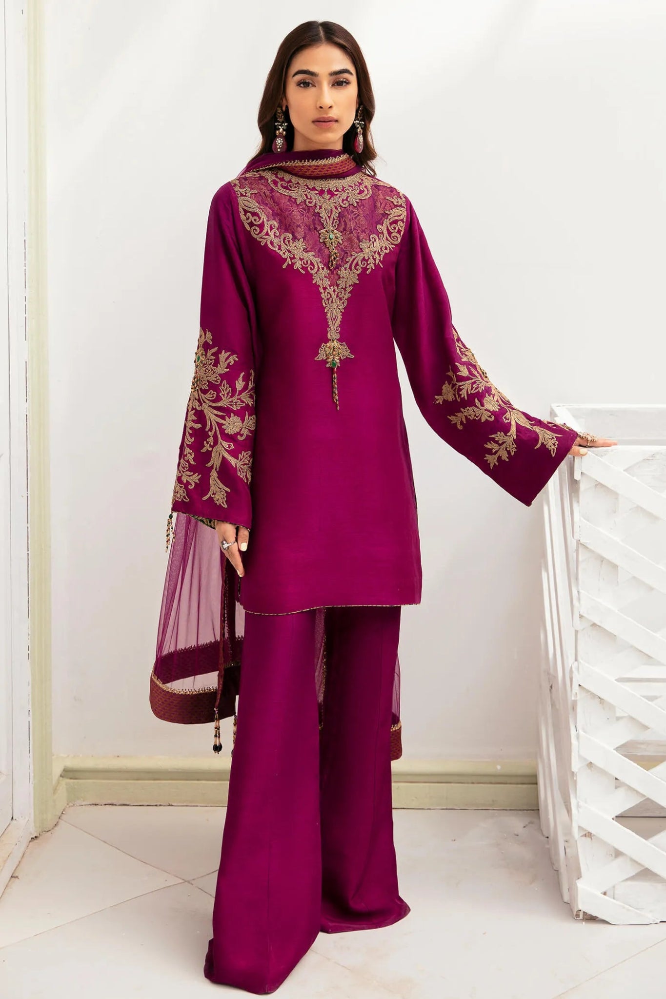 Model wearing a rich mauve MAUVE PASSION dress from Musferah Saad's VIVA LA VIDA collection, showcasing Pakistani clothes online in the UK.