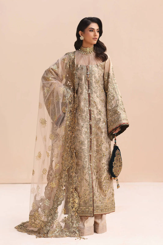 Model in gold Musferah Saad Divine Princess Pakistani wedding attire, UK.