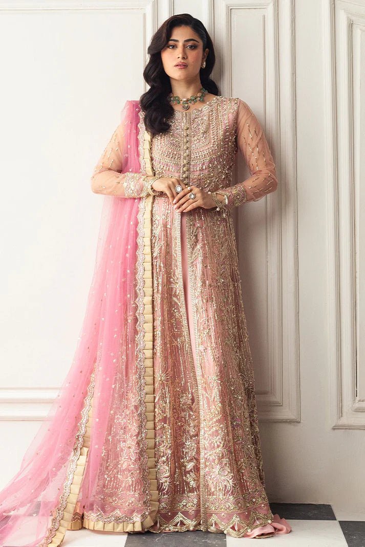 Model wearing a blush pink embellished formal wedding dress, "Amaranth," from Mushq. Pakistani wedding clothes online in the UK.