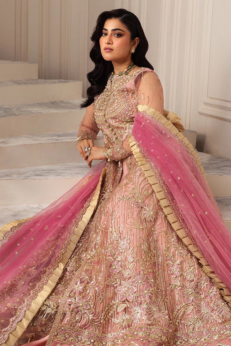 Model wearing a blush pink embellished formal wedding dress, "Amaranth," from Mushq. Pakistani wedding clothes online in the UK.