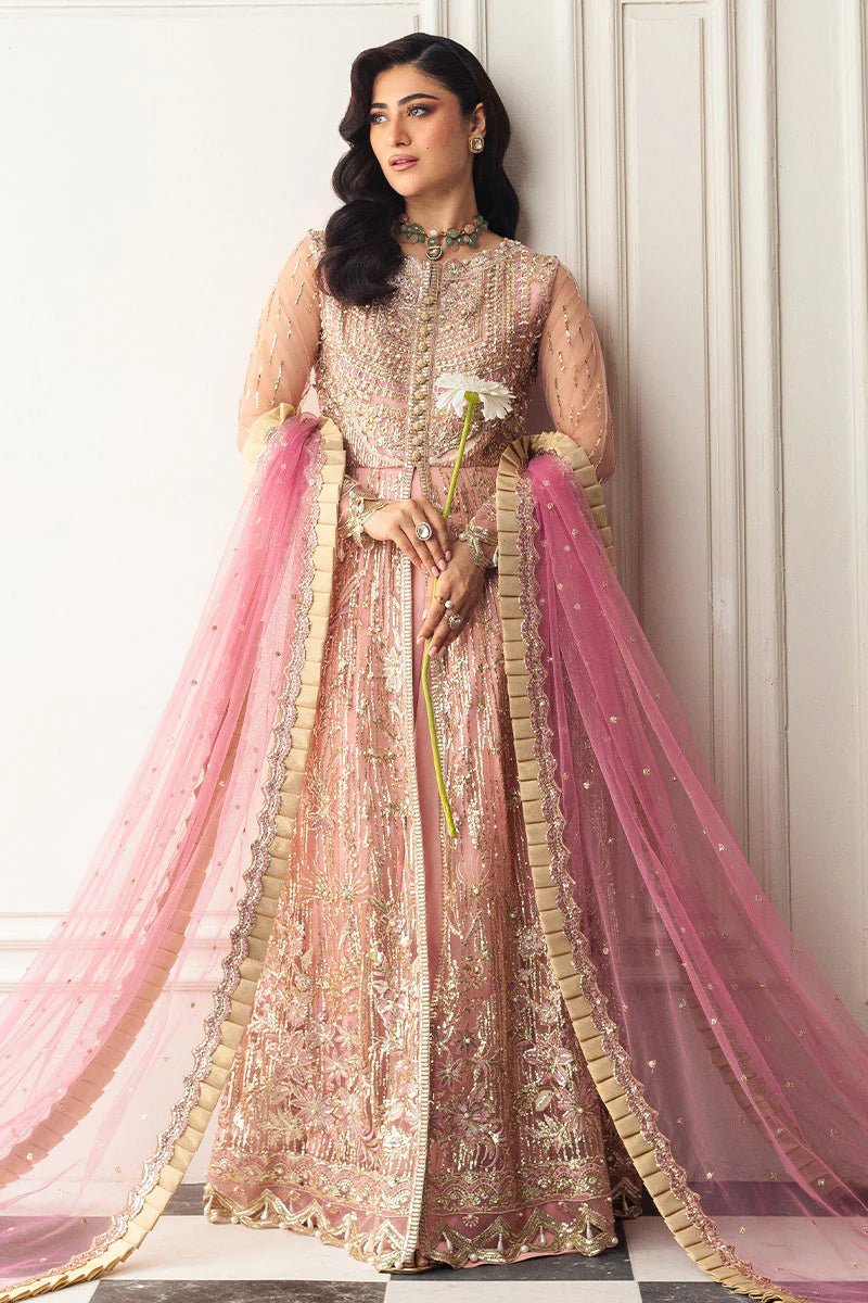 Model wearing a blush pink embellished formal wedding dress, "Amaranth," from Mushq. Pakistani wedding clothes online in the UK.