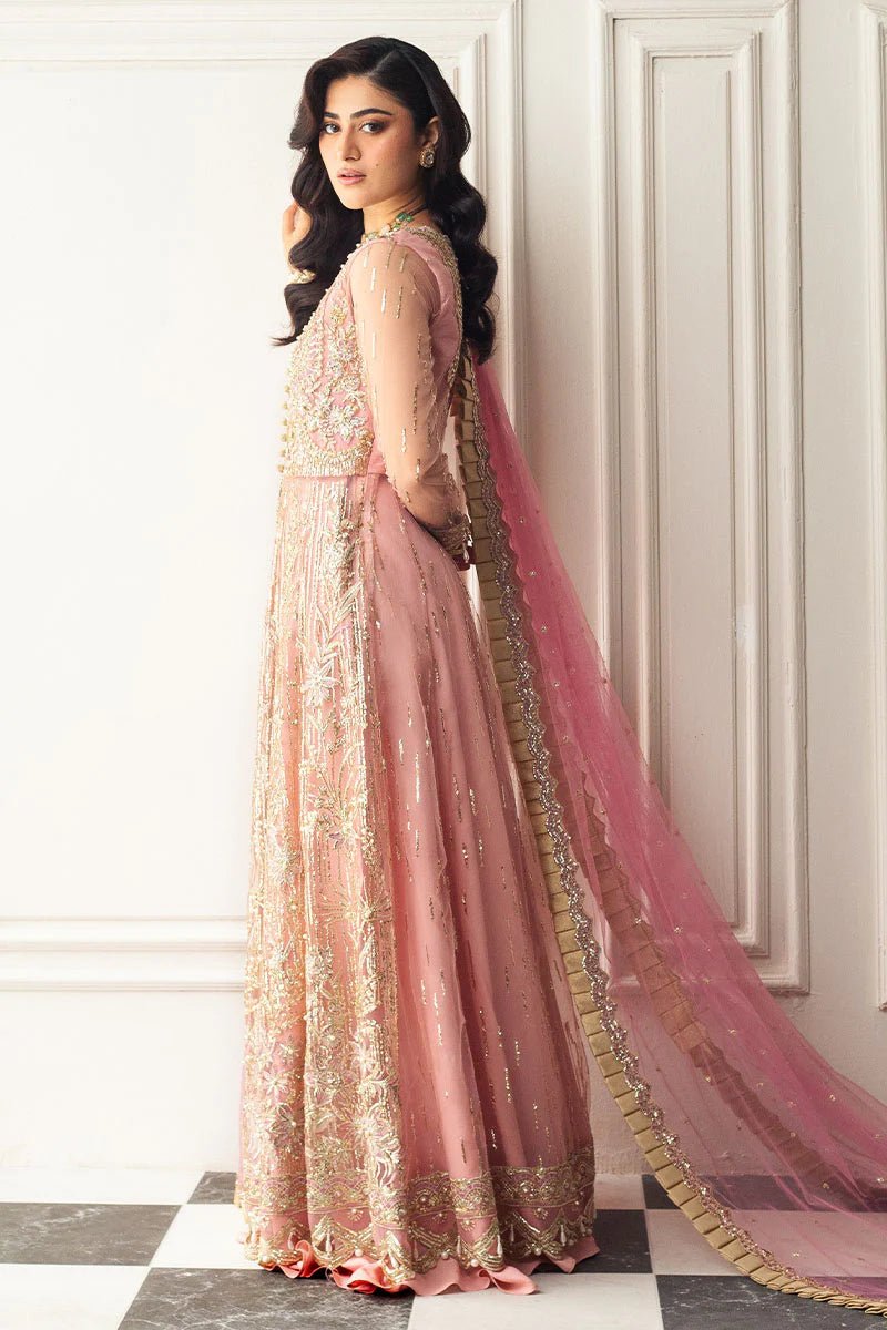 Model wearing a blush pink embellished formal wedding dress, "Amaranth," from Mushq. Pakistani wedding clothes online in the UK.