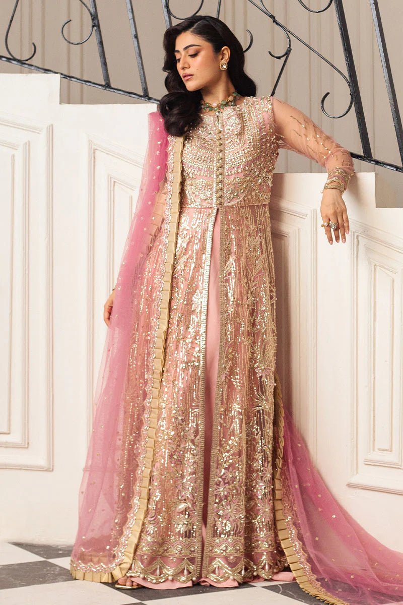 Model wearing a blush pink embellished formal wedding dress, "Amaranth," from Mushq. Pakistani wedding clothes online in the UK.