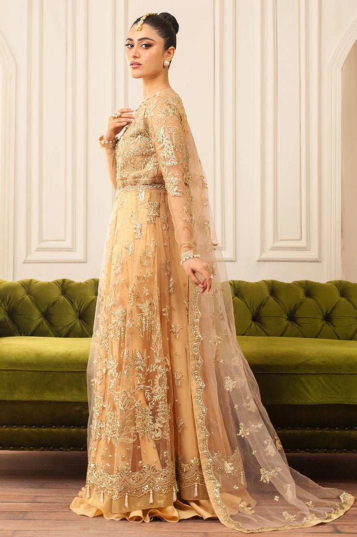 Model wearing a soft chamois wedding formal dress from Mushq, featuring intricate embellishments. Pakistani wedding clothes online in the UK.