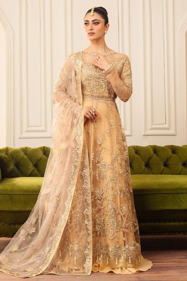 Model wearing a soft chamois wedding formal dress from Mushq, featuring intricate embellishments. Pakistani wedding clothes online in the UK.