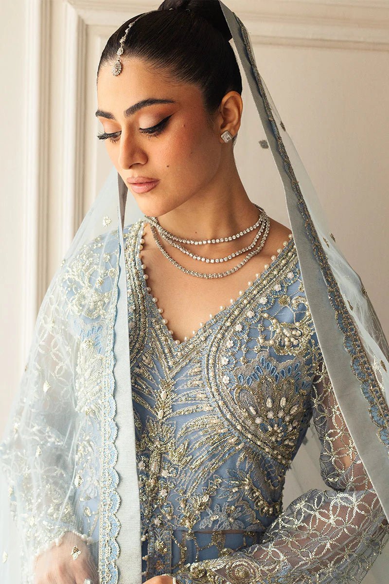 Model wearing a light blue embellished wedding formal dress, "Periwinkle," from Mushq. Pakistani wedding clothes online in the UK.