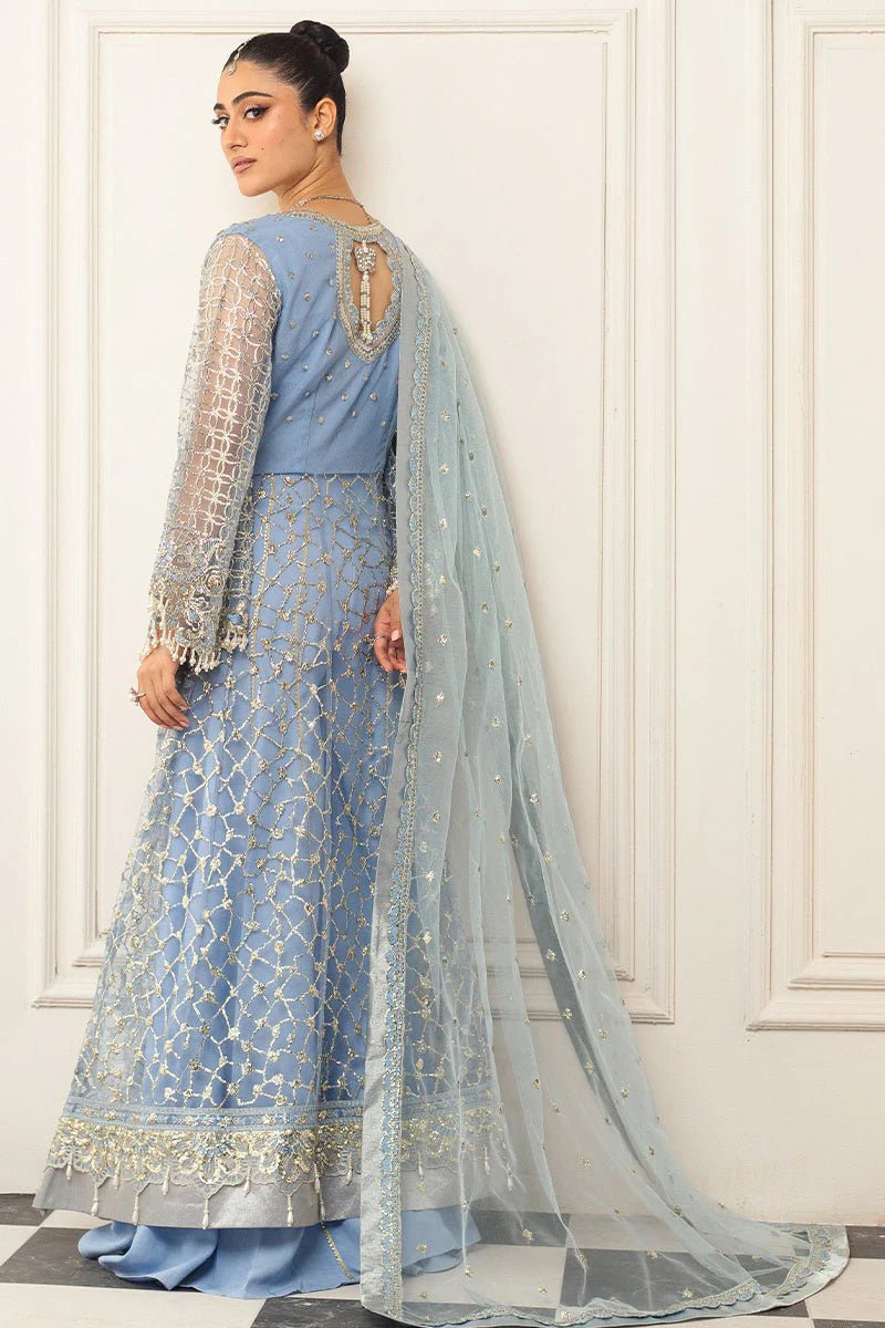 Model wearing a light blue embellished wedding formal dress, "Periwinkle," from Mushq. Pakistani wedding clothes online in the UK.