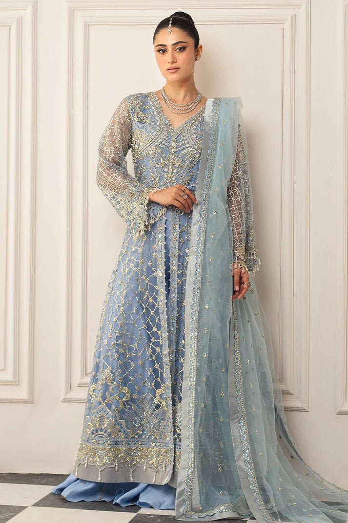 Model wearing a light blue embellished wedding formal dress, "Periwinkle," from Mushq. Pakistani wedding clothes online in the UK.