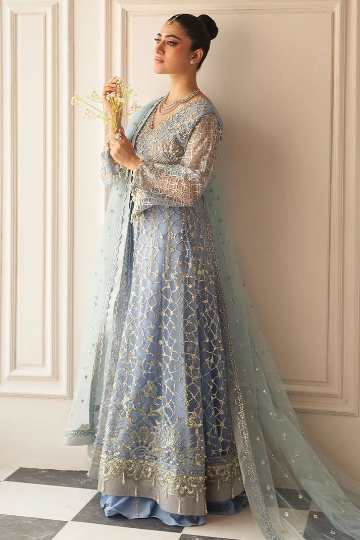 Model wearing a light blue embellished wedding formal dress, "Periwinkle," from Mushq. Pakistani wedding clothes online in the UK.